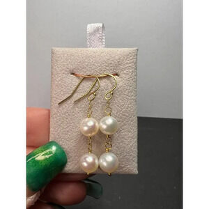 White cultured pearl dangle earrings in gold over sterling silver